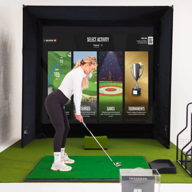 Person using a golf simulator with interactive screen displaying options