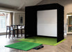Indoor golf simulator setup in a room with a dining table and chaira